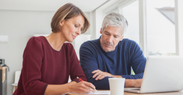 Couple looking up information for COPAXONE®.