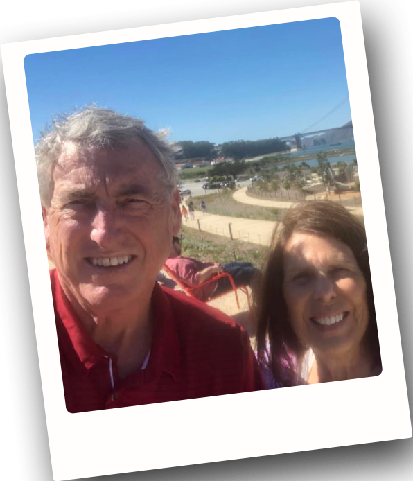 Therese and her husband smiling.